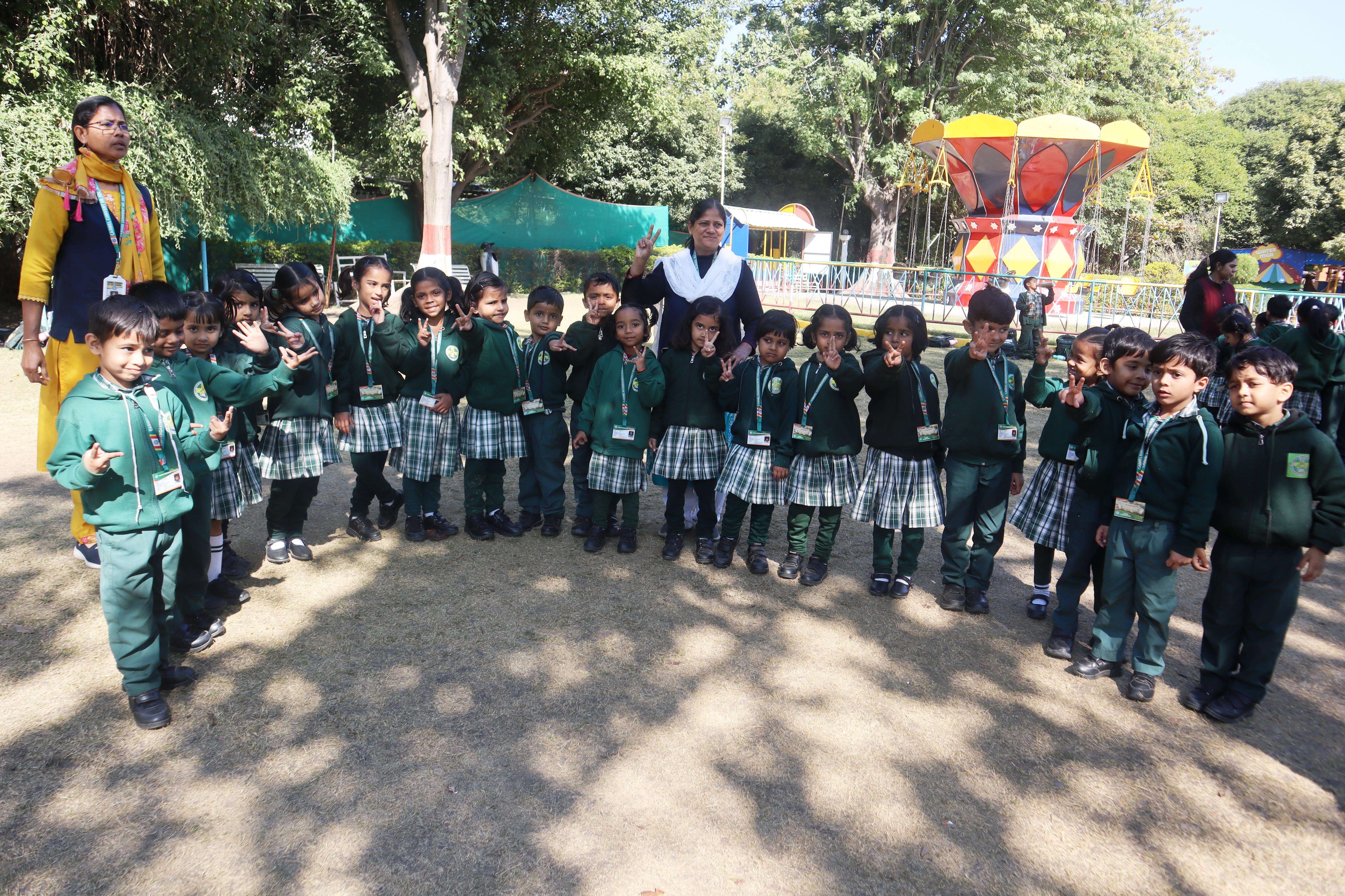 Kindergarten children and their teachers on picnic day